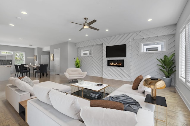 525 31st Ave N Unit A, Nashville, TN 37209 - living room featuring a fireplace, recessed lighting, ceiling fan, an accent wall, and baseboards