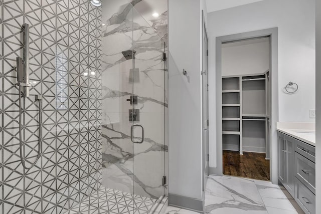 525 31st Ave N Unit A, Nashville, TN 37209 - full bathroom featuring a marble finish shower, vanity, a spacious closet, and marble finish flooring