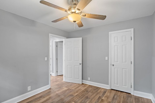 2614 Flamingo Dr, Nashville, TN 37207 - unfurnished bedroom with baseboards, wood finished floors, and ceiling fan