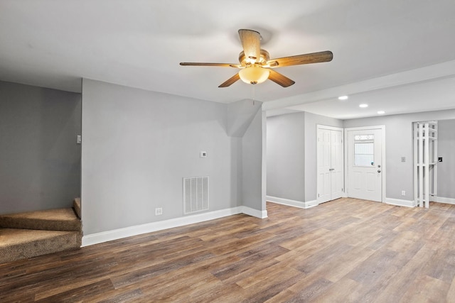 2614 Flamingo Dr, Nashville, TN 37207 - unfurnished living room with ceiling fan, baseboards, recessed lighting, wood finished floors, and stairs