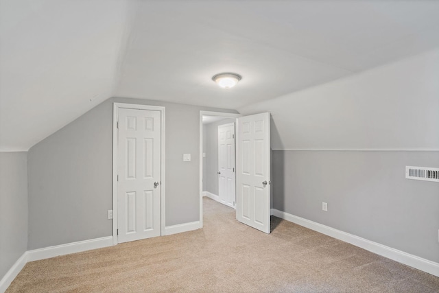 2614 Flamingo Dr, Nashville, TN 37207 - additional living space with vaulted ceiling, light colored carpet, and baseboards
