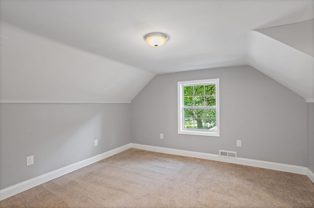 2614 Flamingo Dr, Nashville, TN 37207 - additional living space with lofted ceiling, baseboards, and carpet flooring