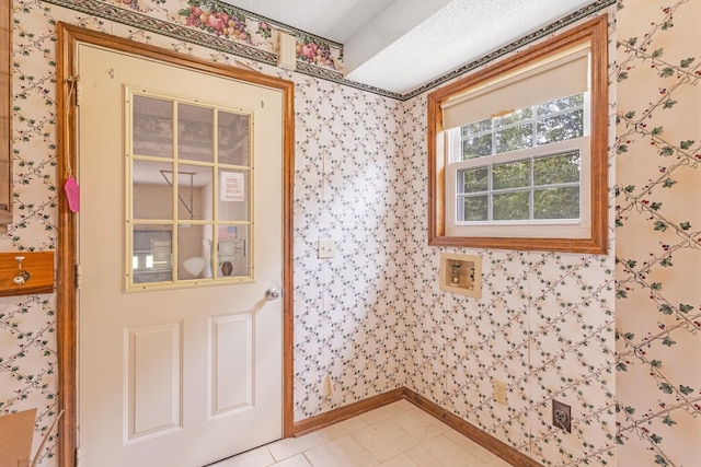 220 Winton Way Rd, Manchester, TN 37355 - entryway with wallpapered walls, baseboards, and light tile patterned floors