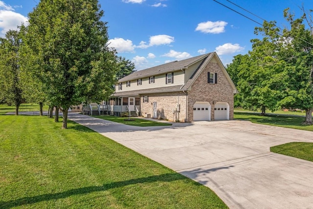 220 Winton Way Rd, Manchester, TN 37355 - view of front facade with a garage, driveway, brick siding, and a front yard