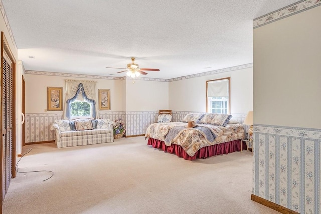 220 Winton Way Rd, Manchester, TN 37355 - carpeted bedroom with multiple windows, a wainscoted wall, a textured ceiling, and ceiling fan