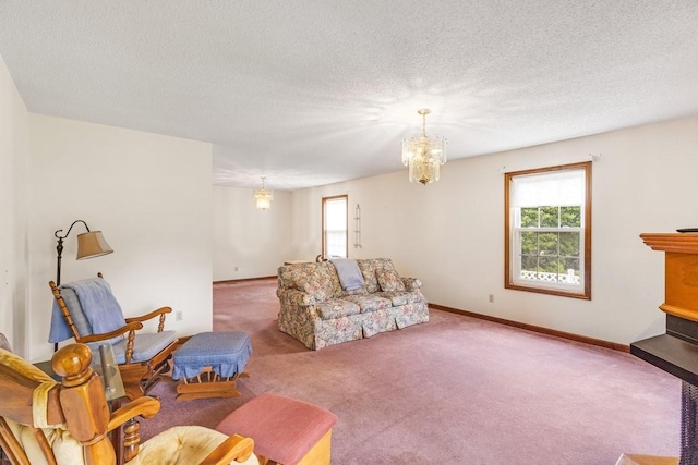 220 Winton Way Rd, Manchester, TN 37355 - carpeted living area featuring plenty of natural light, a chandelier, baseboards, and a textured ceiling