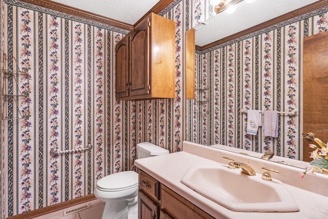 220 Winton Way Rd, Manchester, TN 37355 - bathroom featuring vanity, toilet, tile patterned flooring, crown molding, and a textured ceiling