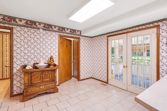 220 Winton Way Rd, Manchester, TN 37355 - doorway featuring french doors, wallpapered walls, light tile patterned floors, and baseboards
