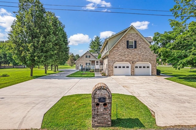 220 Winton Way Rd, Manchester, TN 37355 - view of front facade featuring concrete driveway, a front yard, stone siding, and a garage