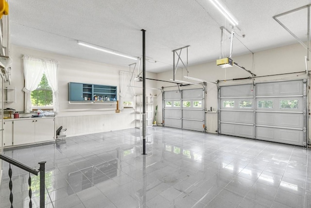 220 Winton Way Rd, Manchester, TN 37355 - garage featuring a garage door opener and wainscoting