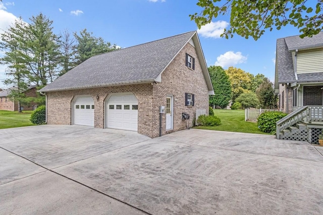 220 Winton Way Rd, Manchester, TN 37355 - view of side of property with brick siding, a garage, driveway, and a lawn