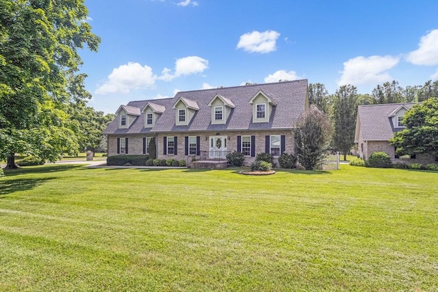 220 Winton Way Rd, Manchester, TN 37355 - cape cod home with a front lawn and brick siding
