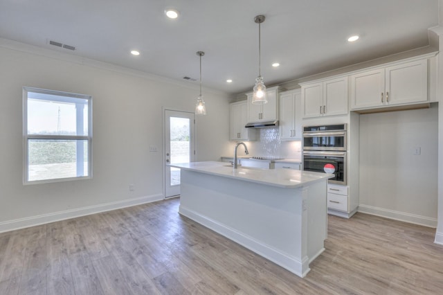 475 Triple Crown Cir, Gallatin, TN 37066 - kitchen with stainless steel double oven, light countertops, white cabinetry, crown molding, and baseboards