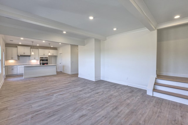 475 Triple Crown Cir, Gallatin, TN 37066 - unfurnished living room featuring beam ceiling, baseboards, light wood finished floors, crown molding, and recessed lighting