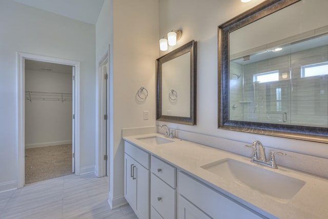 475 Triple Crown Cir, Gallatin, TN 37066 - bathroom with double vanity, a stall shower, a walk in closet, and baseboards