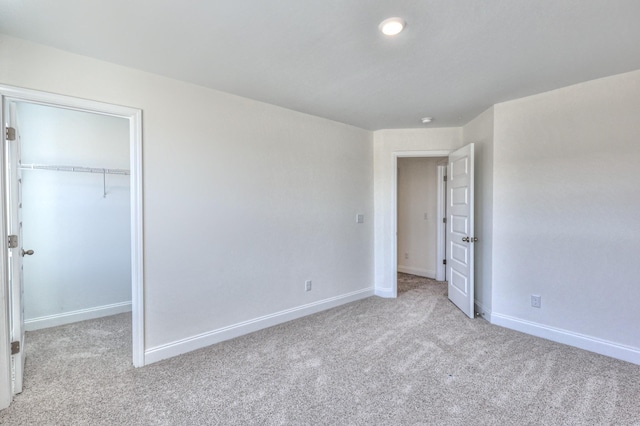 475 Triple Crown Cir, Gallatin, TN 37066 - unfurnished bedroom with light colored carpet, baseboards, a spacious closet, and a closet