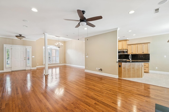 204 Magnolia Glen Ct, Manchester, TN 37355 - unfurnished living room with ornate columns, a ceiling fan, crown molding, light wood-style flooring, and recessed lighting