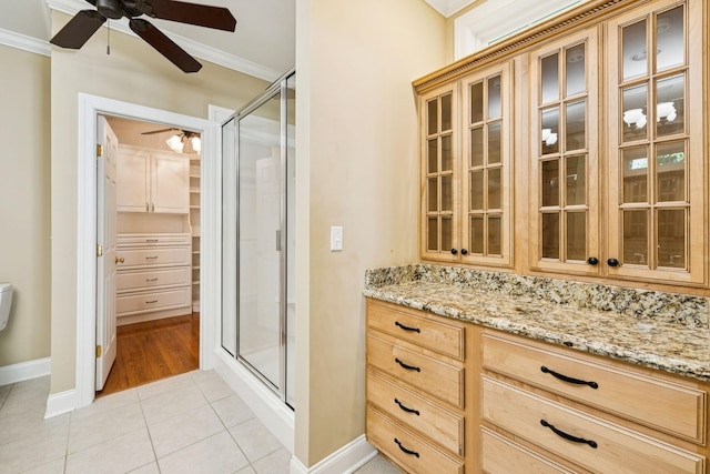 204 Magnolia Glen Ct, Manchester, TN 37355 - full bathroom with a ceiling fan, tile patterned flooring, a stall shower, ornamental molding, and baseboards