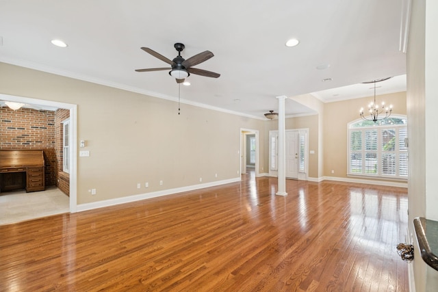 204 Magnolia Glen Ct, Manchester, TN 37355 - unfurnished living room featuring decorative columns, light wood-type flooring, a ceiling fan, crown molding, and baseboards