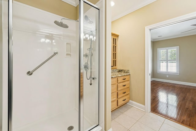 204 Magnolia Glen Ct, Manchester, TN 37355 - bathroom with crown molding, a shower stall, baseboards, vanity, and tile patterned flooring