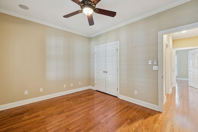 204 Magnolia Glen Ct, Manchester, TN 37355 - unfurnished bedroom with light wood-style floors, baseboards, crown molding, a closet, and a ceiling fan
