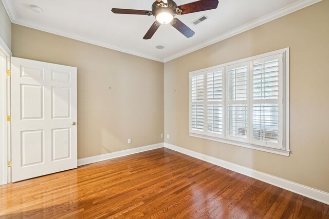 204 Magnolia Glen Ct, Manchester, TN 37355 - spare room with healthy amount of natural light, wood finished floors, crown molding, and baseboards