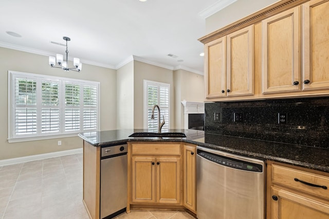 204 Magnolia Glen Ct, Manchester, TN 37355 - kitchen featuring stainless steel dishwasher, a sink, a peninsula, a chandelier, and baseboards