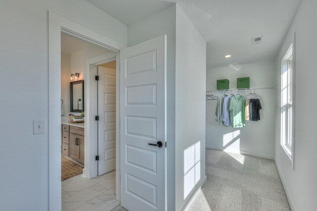 471 Triple Crown Cir, Gallatin, TN 37066 - corridor with healthy amount of natural light, light marble finish flooring, recessed lighting, and baseboards