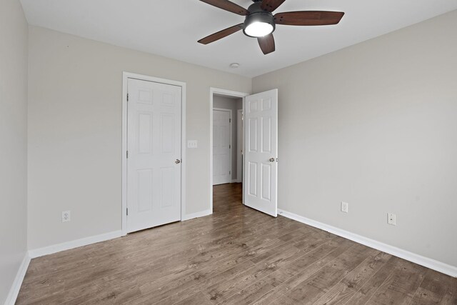 3609 Chunn Valley Dr, Spring Hill, TN 37174 - unfurnished bedroom featuring wood finished floors, baseboards, and ceiling fan
