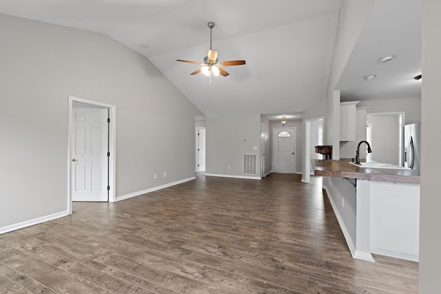 3609 Chunn Valley Dr, Spring Hill, TN 37174 - unfurnished living room featuring ceiling fan, dark wood-style flooring, baseboards, and high vaulted ceiling
