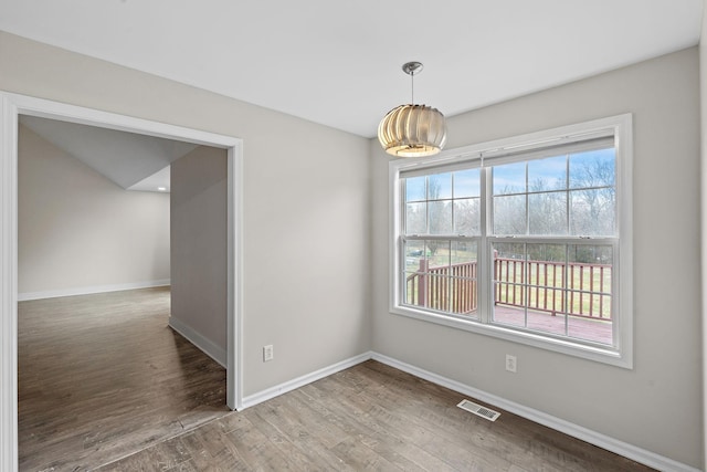3609 Chunn Valley Dr, Spring Hill, TN 37174 - unfurnished dining area featuring baseboards and wood finished floors