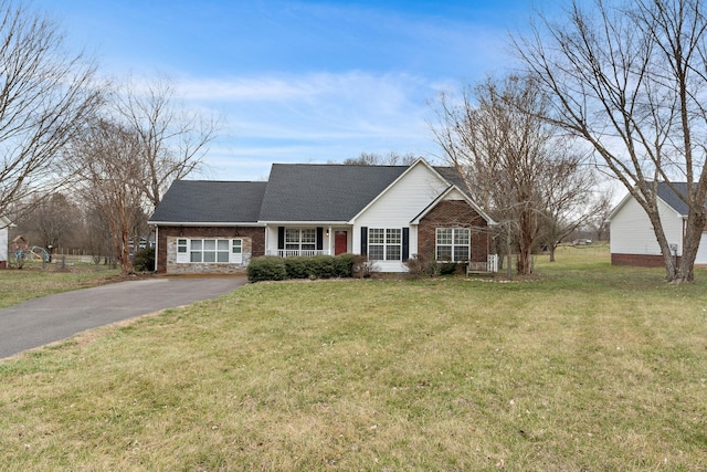 3609 Chunn Valley Dr, Spring Hill, TN 37174 - view of front of home with asphalt driveway, a front yard, and brick siding