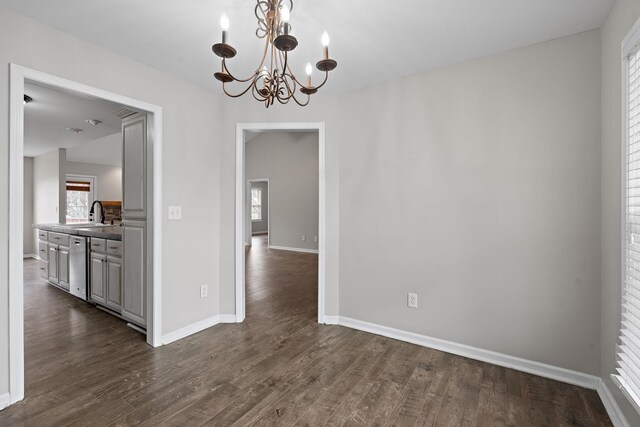3609 Chunn Valley Dr, Spring Hill, TN 37174 - unfurnished dining area with a chandelier, dark wood-style floors, and baseboards