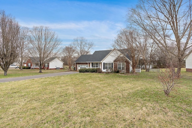3609 Chunn Valley Dr, Spring Hill, TN 37174 - single story home with asphalt driveway, a front lawn, and brick siding