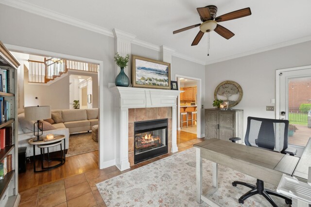 1926 Cliffview Ct, Murfreesboro, TN 37128 - tiled home office featuring ornamental molding, a tiled fireplace, a ceiling fan, and baseboards