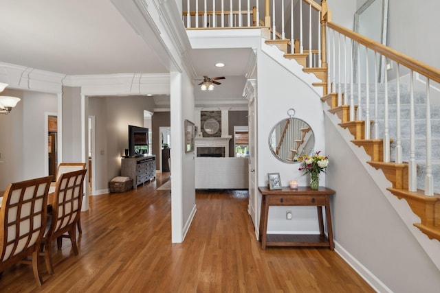 1926 Cliffview Ct, Murfreesboro, TN 37128 - entryway with ceiling fan, a fireplace, wood finished floors, baseboards, and ornamental molding