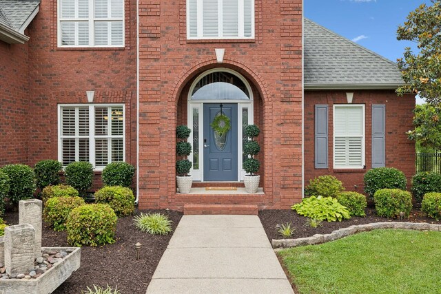 1926 Cliffview Ct, Murfreesboro, TN 37128 - view of exterior entry with roof with shingles and brick siding