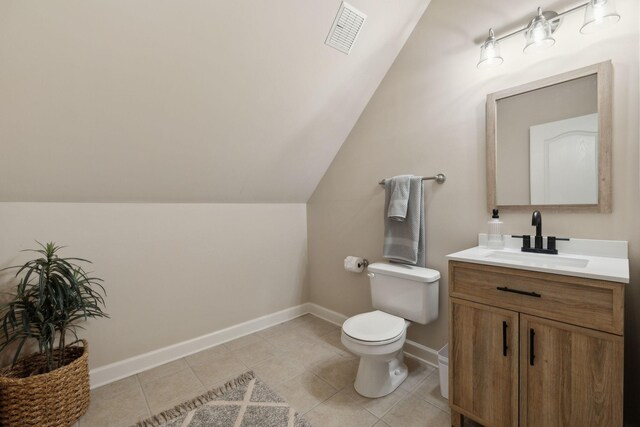 1926 Cliffview Ct, Murfreesboro, TN 37128 - bathroom with toilet, vanity, baseboards, lofted ceiling, and tile patterned flooring
