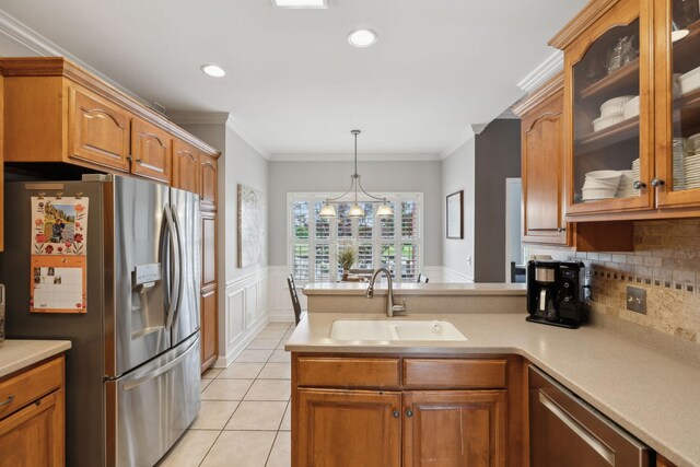 1926 Cliffview Ct, Murfreesboro, TN 37128 - kitchen featuring appliances with stainless steel finishes, a sink, a peninsula, decorative backsplash, and glass insert cabinets