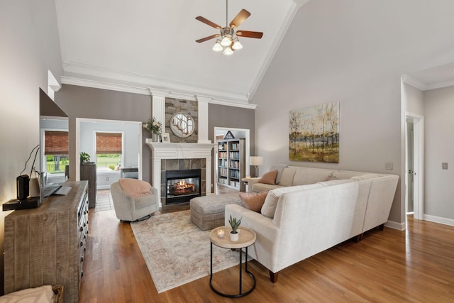 1926 Cliffview Ct, Murfreesboro, TN 37128 - living area with ornamental molding, ceiling fan, wood finished floors, high vaulted ceiling, and a tiled fireplace