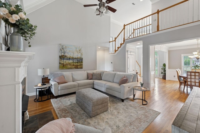 1926 Cliffview Ct, Murfreesboro, TN 37128 - living area featuring stairs, ornamental molding, ceiling fan, wood finished floors, and a fireplace with flush hearth