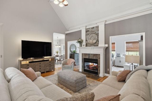 1926 Cliffview Ct, Murfreesboro, TN 37128 - living room with ornamental molding, high vaulted ceiling, healthy amount of natural light, wood finished floors, and a fireplace