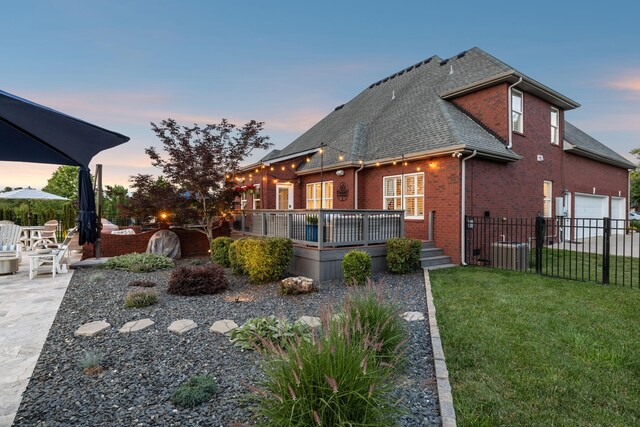 1926 Cliffview Ct, Murfreesboro, TN 37128 - back of house featuring roof with shingles, brick siding, a wooden deck, a patio area, and central AC unit