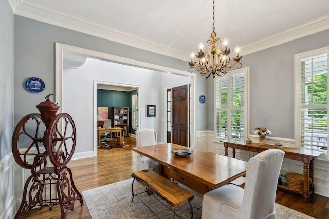 1577 Westhaven Blvd, Franklin, TN 37064 - dining space featuring plenty of natural light, wood finished floors, a chandelier, ornamental molding, and a wainscoted wall