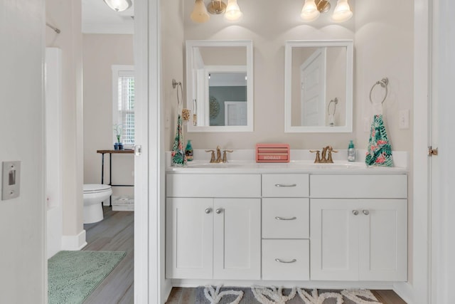 1240 Hensfield Dr, Murfreesboro, TN 37128 - full bathroom featuring toilet, double vanity, and wood finished floors