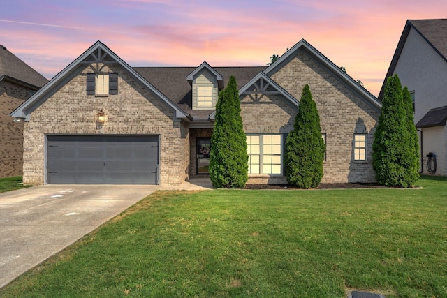 1240 Hensfield Dr, Murfreesboro, TN 37128 - view of front of property featuring brick siding, a front lawn, driveway, and an attached garage
