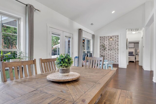 1240 Hensfield Dr, Murfreesboro, TN 37128 - dining area with vaulted ceiling, dark wood-style flooring, and baseboards