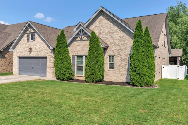 1240 Hensfield Dr, Murfreesboro, TN 37128 - view of front of house with brick siding, concrete driveway, and a shingled roof