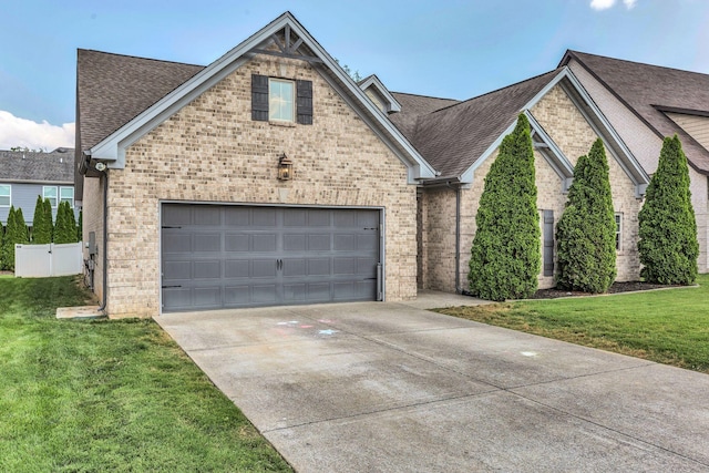 1240 Hensfield Dr, Murfreesboro, TN 37128 - view of front facade with brick siding, driveway, a garage, and roof with shingles