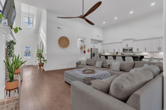 1240 Hensfield Dr, Murfreesboro, TN 37128 - living room with a towering ceiling, plenty of natural light, baseboards, a ceiling fan, and recessed lighting